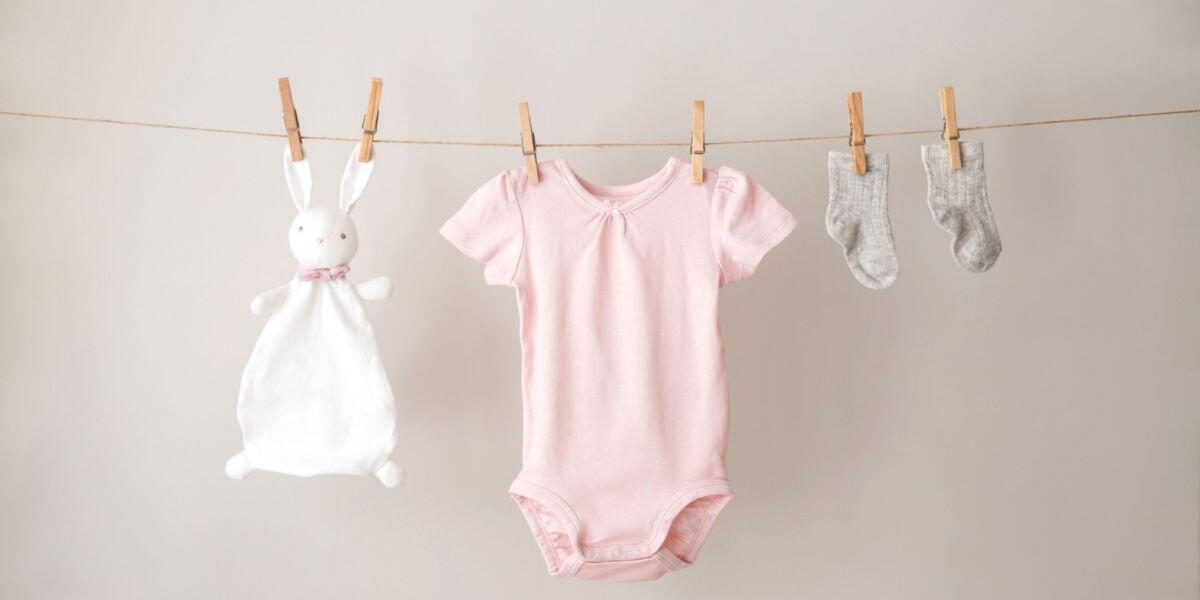 baby clothes gathered for future adopted child