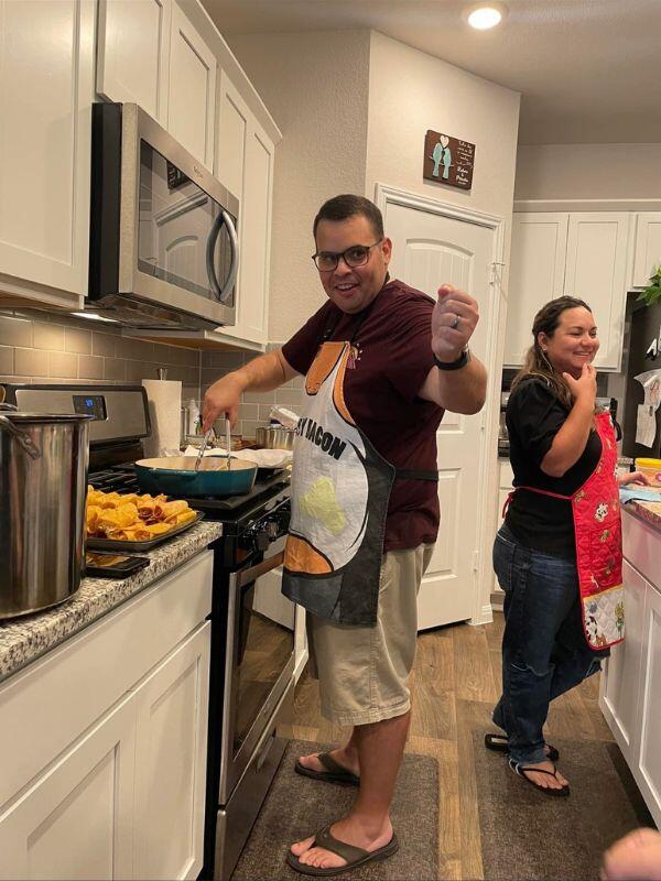 adoptive parents cooking in their georgetown, tx home