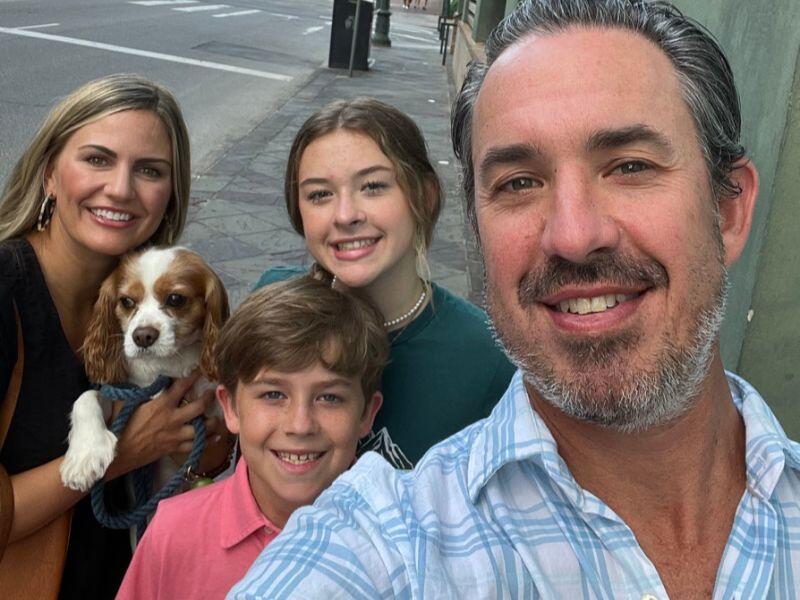 Amy and Ryan, a Texas couple looking to adopt a baby, with their kids and dog