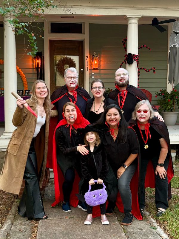 LGBT adoptive family dressed as vampires with family at halloween