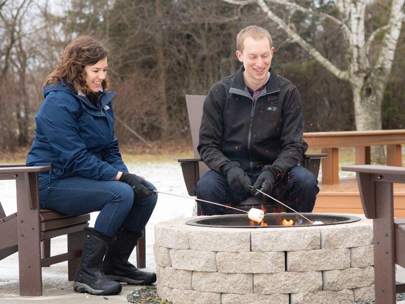 Prospective adoptive couple making s'mores