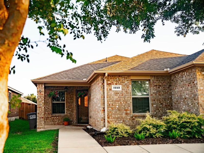 Suburban brick one-story home near Dallas, TX