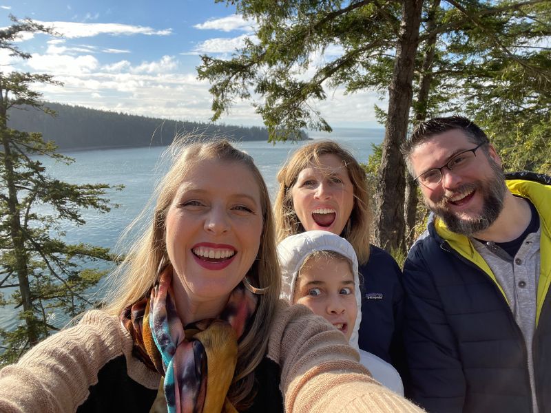 Texas adoptive parents with family in front of a lake