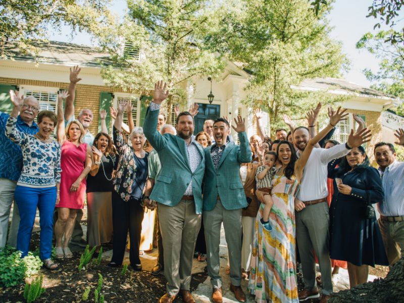 Kyle and Andrew at their home with large extended multiracial family