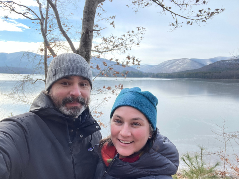 Lily and Jesse, a Baltimore couple that wants to adopt, in front of a lake on a cold day