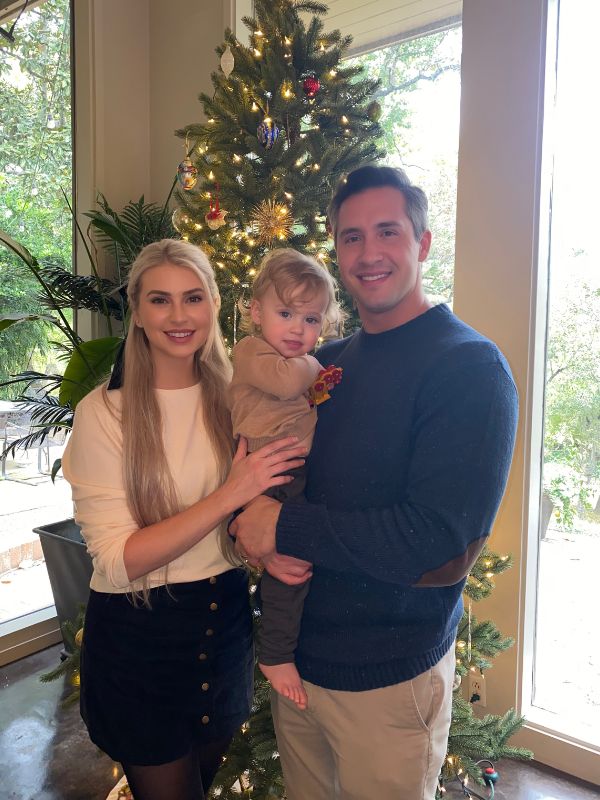 Prospective adoptive family in front of their Christmas tree at home in Houston