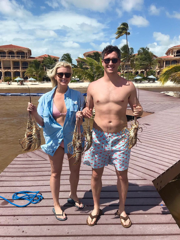 Texas adoptive parents on a dock with the fish they caught