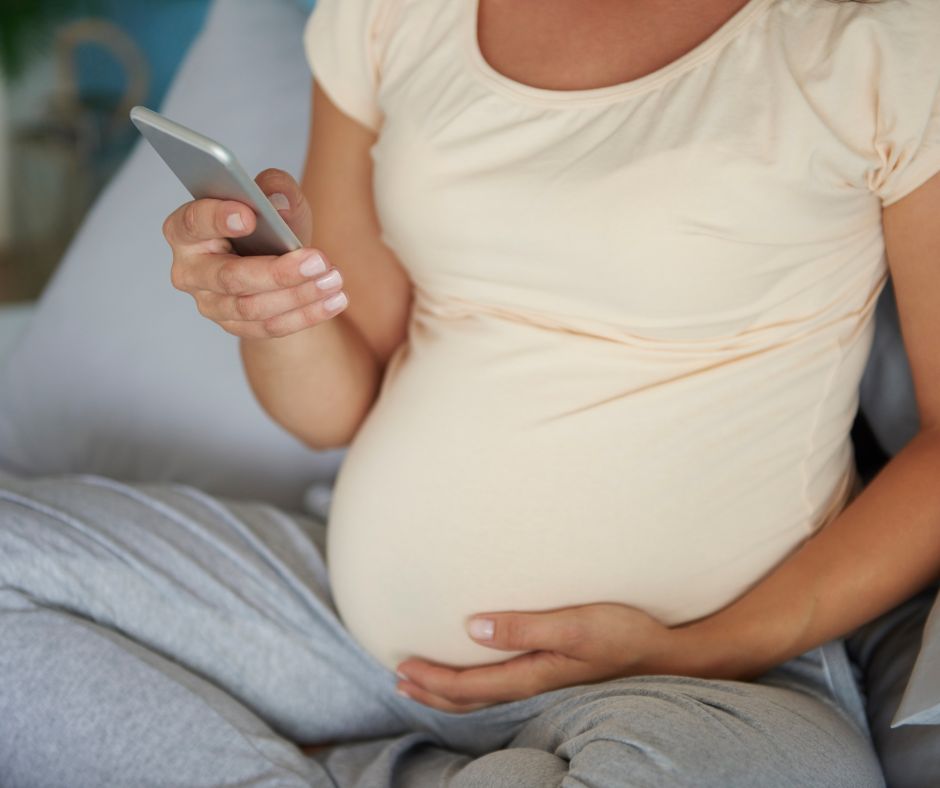 women researching texas adoption agencies on her mobile phone