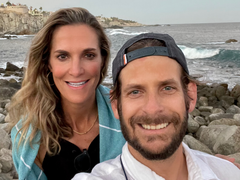 Adoptive parents from San Antonio, Laura and Nathan, on a rocky beach