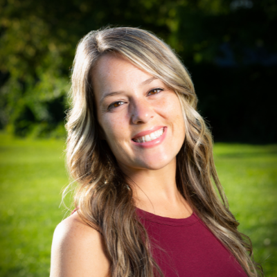 Headshot of Jess, an Austin parent looking to adopt a baby, smiling outside