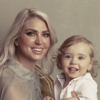 Mary, a white adoptive mom with long blond hair smiling with her son